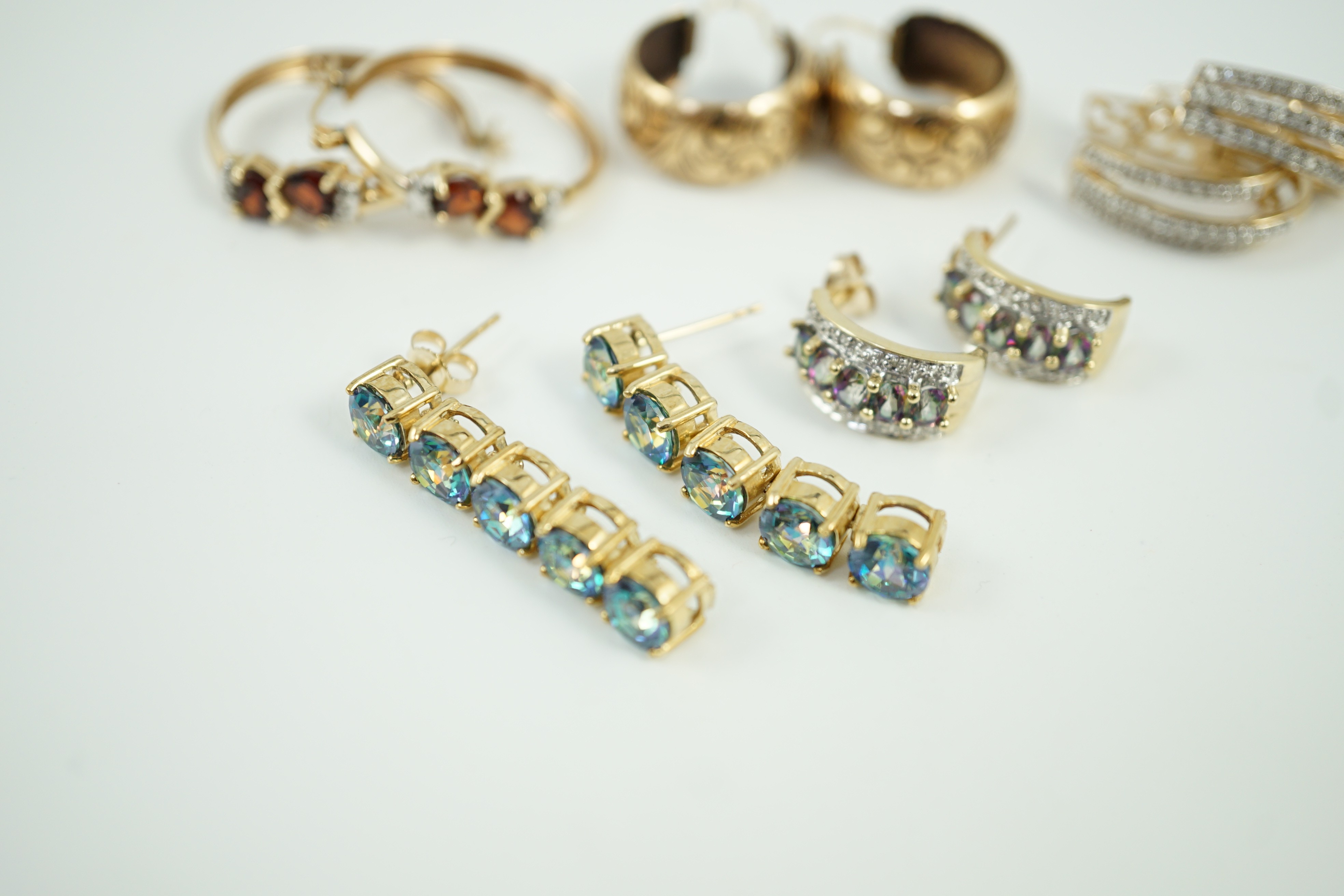 Four assorted modern pairs of 9ct gold and gem set earrings and one pair of yellow metal earrings, gross weight, 23.2 grams.